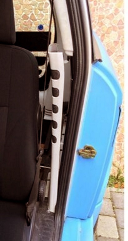 The door from a side, and the panel that was removed to get access to the area from inside